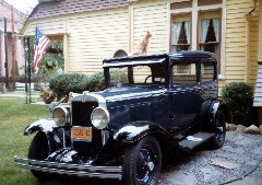 Old car with a cat on the roof